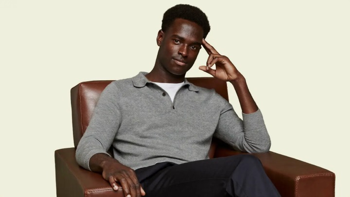 A founder sitting in a leather armchair